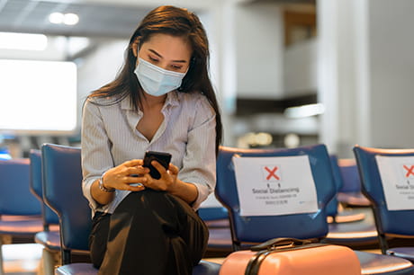 Woman with facemask at airport